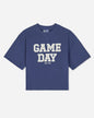 A blue short-sleeve french terry t-shirt with 'GAME DAY' printed in bold white block letters on the front, with 'GOAT USA' printed underneath, shown against a light gray background.#color_navy