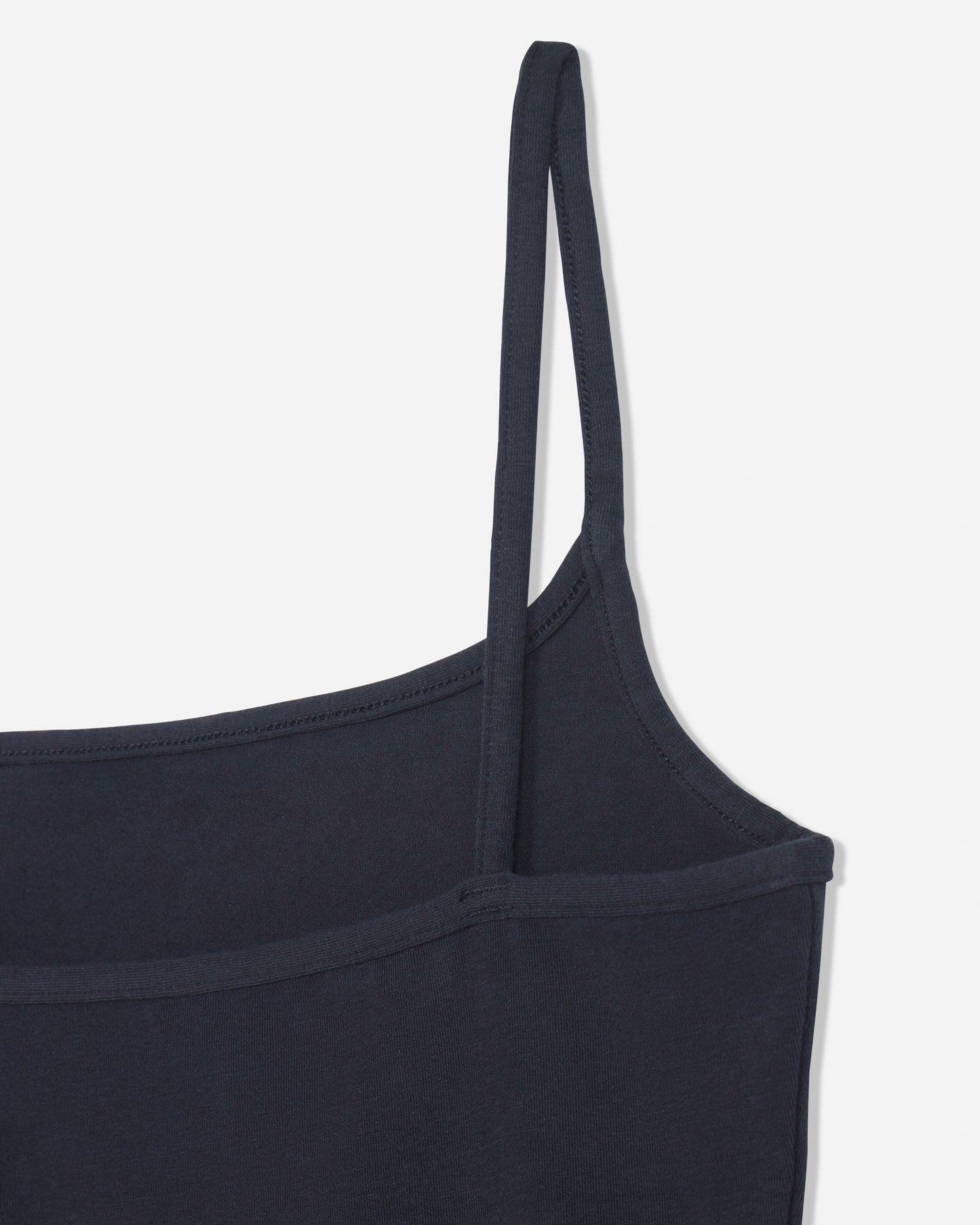 Close-up of back of black cami tank top#color_black