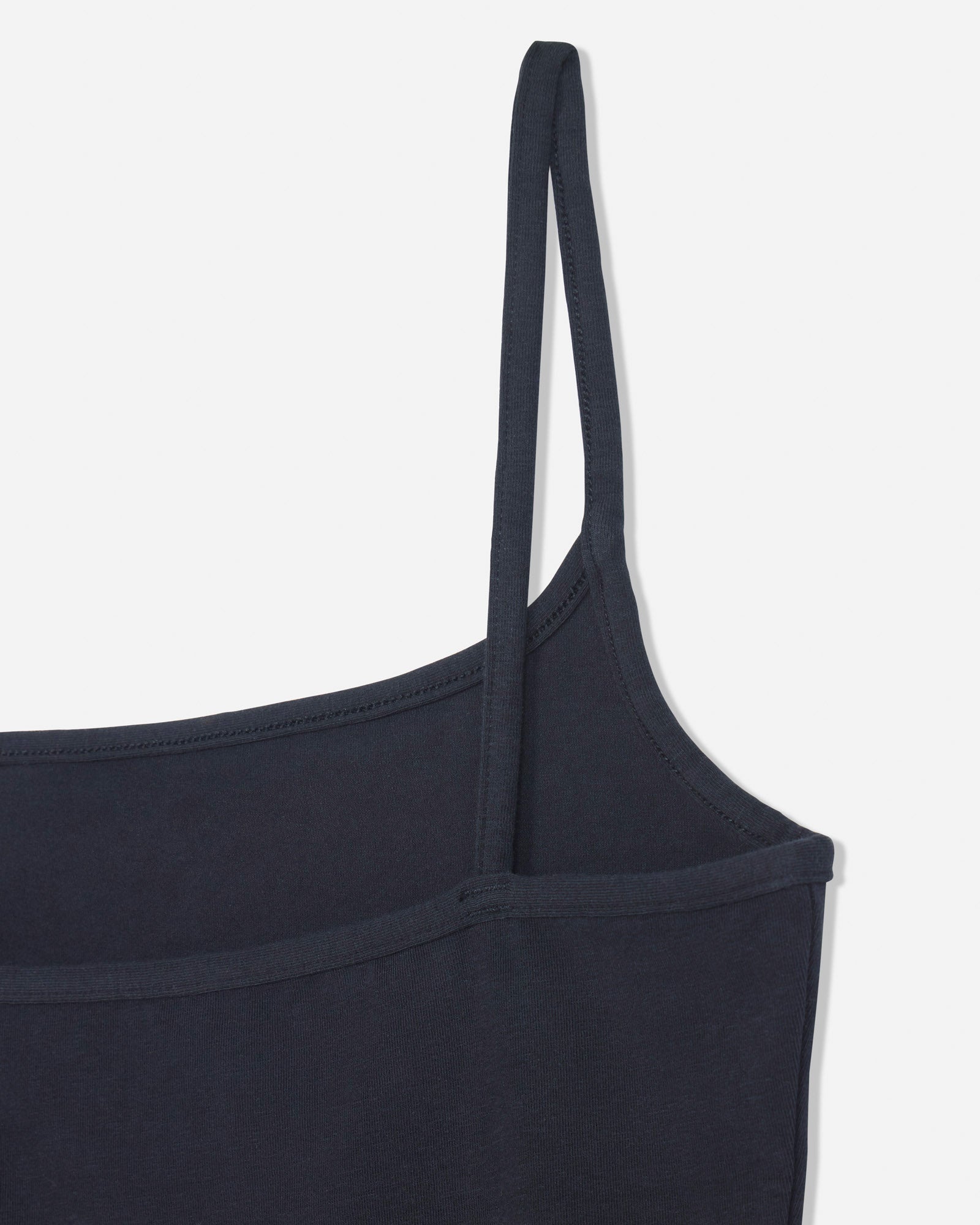 Close-up of back of black cami tank top#color_black