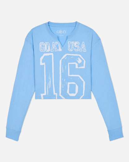 Light blue long-sleeve shirt with 'GOAT USA 16' text on a light gray background
