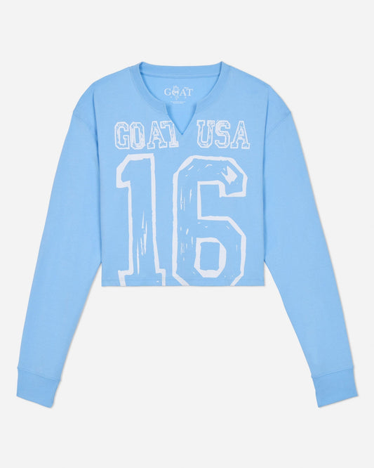 Light blue long-sleeve shirt with 'GOAT USA 16' text on a light gray background