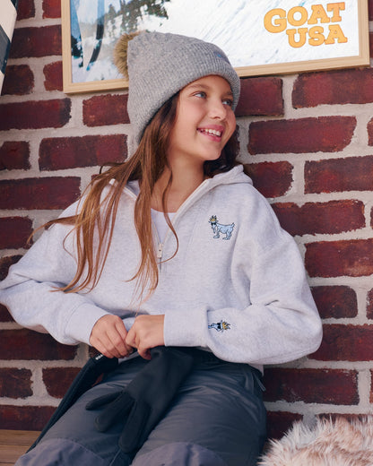 Person in a gray half zip hoodie#color_pale-gray