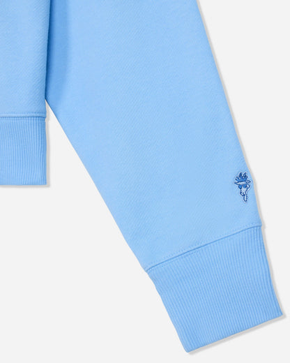 Close-up of sleeve on oversized carolina blue crewneck#color_carolina-blue