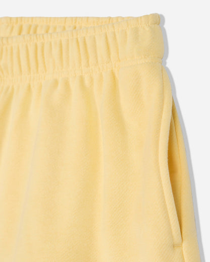 Close-up of pocket of corn milk sweat shorts#color_corn-milk