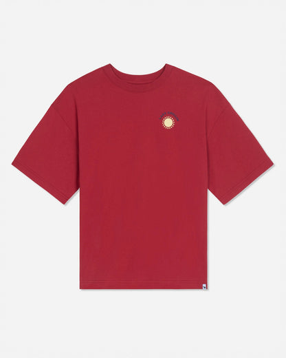 Front of red oversized t-shirt with left-chest graphic