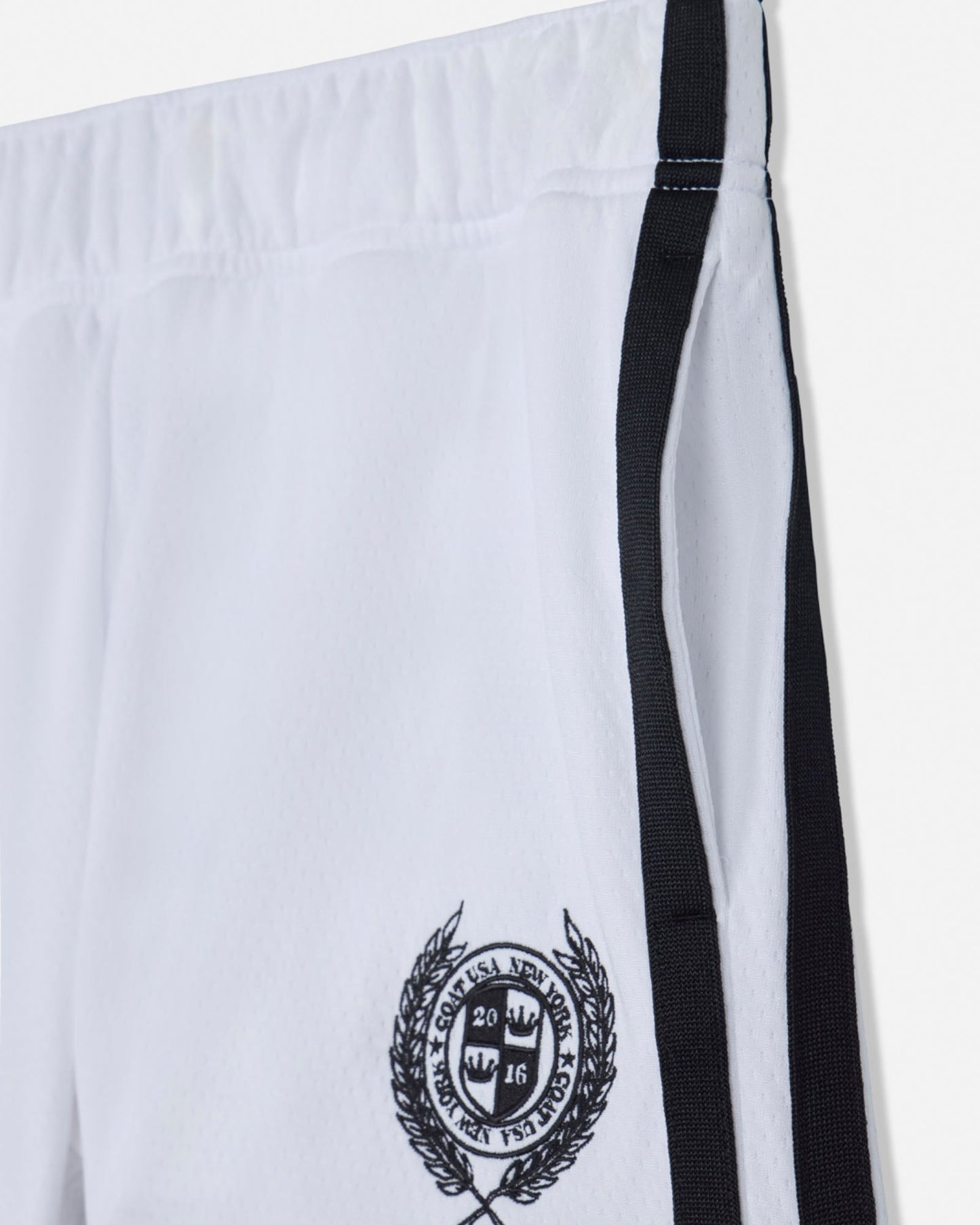 White shorts with black emblem and straps on a white background#color_white