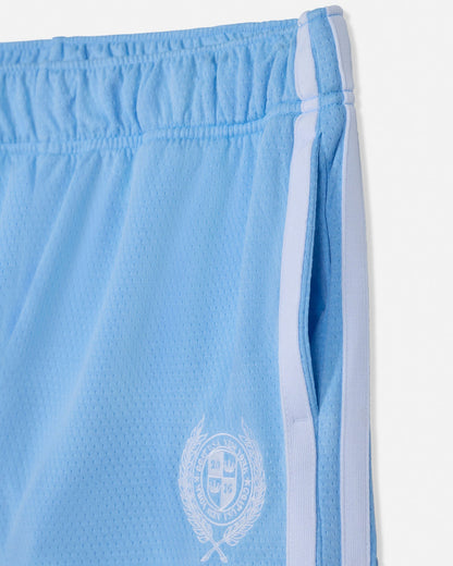 Light blue shorts with a white emblem and trim on a white background#color_carolina-blue
