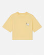 Yellow t-shirt with a small graphic on a light gray background#color_corn-milk