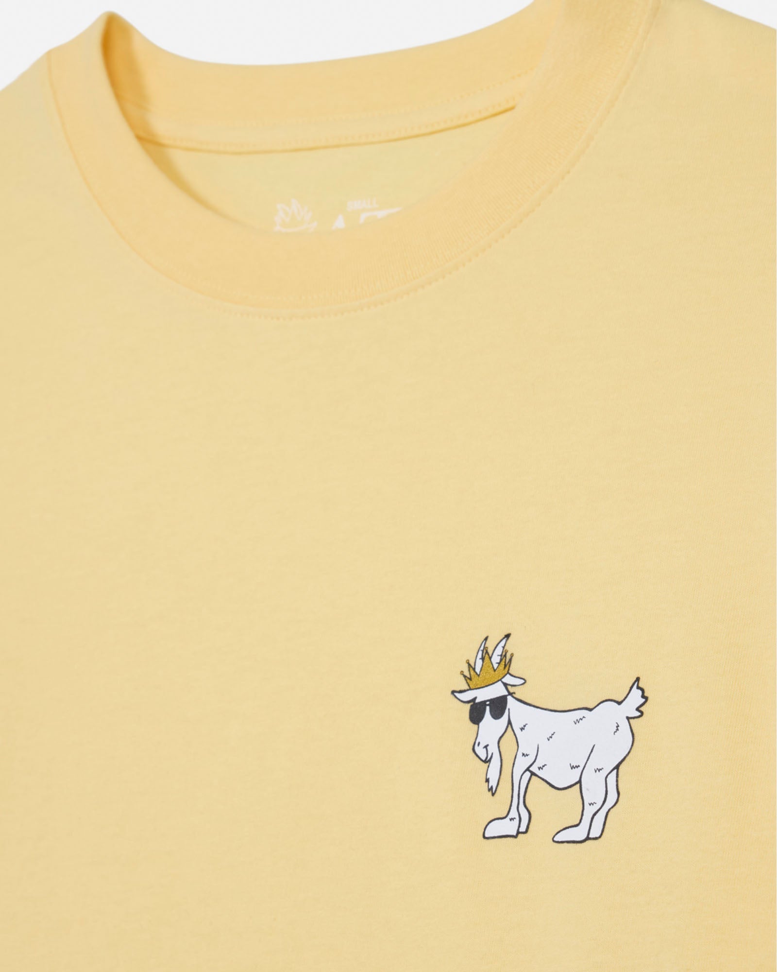 Yellow t-shirt with a cartoon goat wearing a crown on a white background#color_corn-milk
