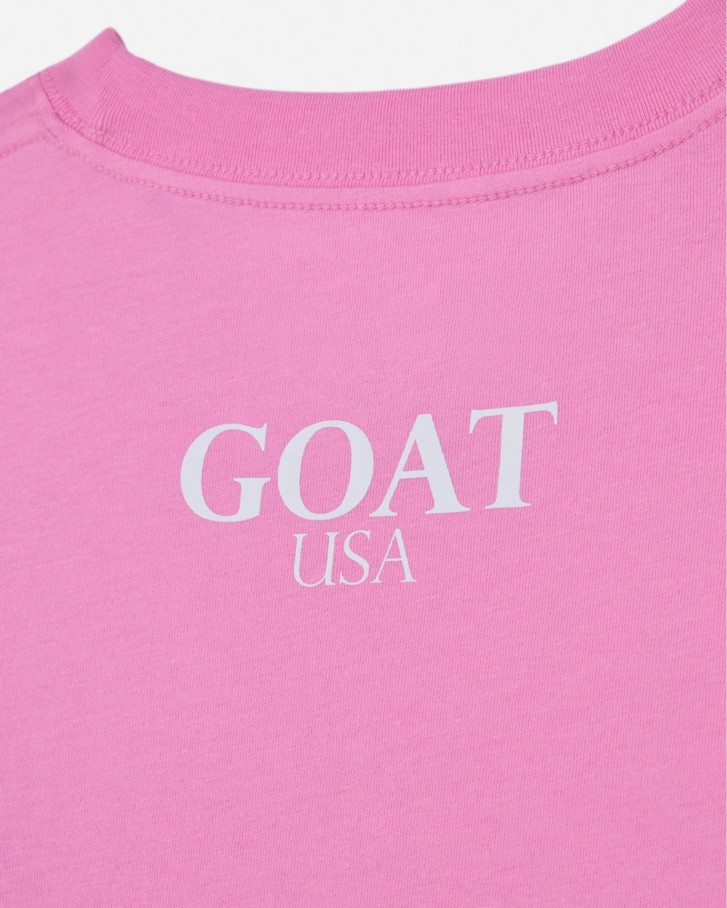 Back of pink t-shirt with 'GOAT USA' text#color_paradise-pink