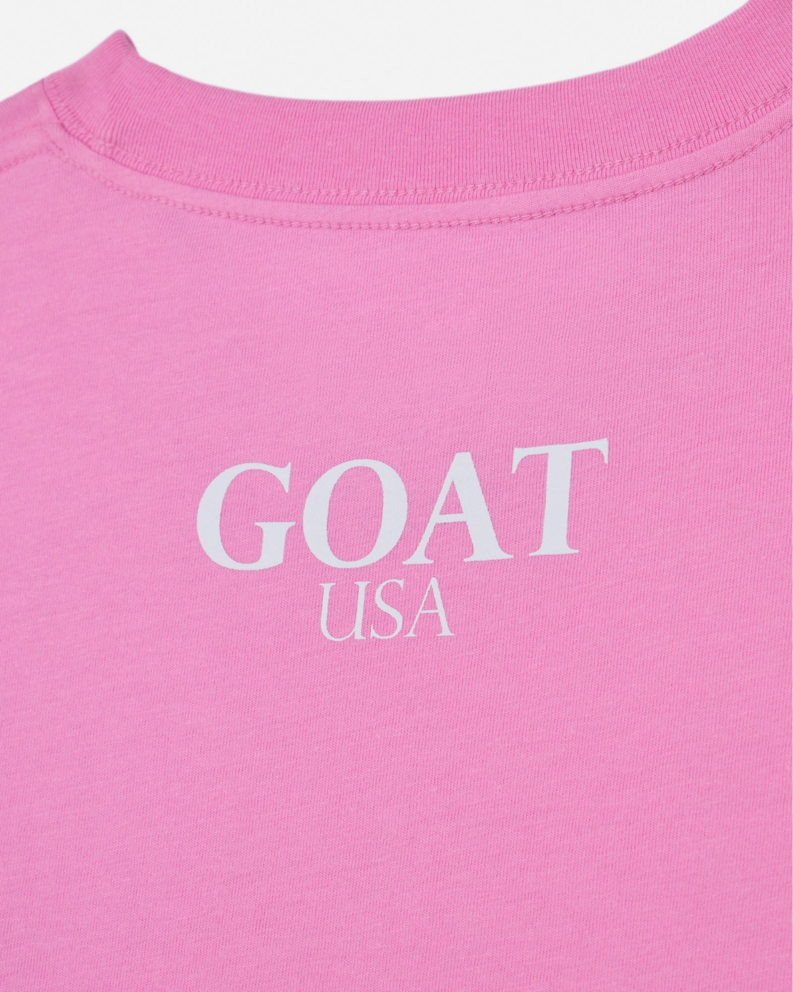 Back of pink t-shirt with 'GOAT USA' text#color_paradise-pink