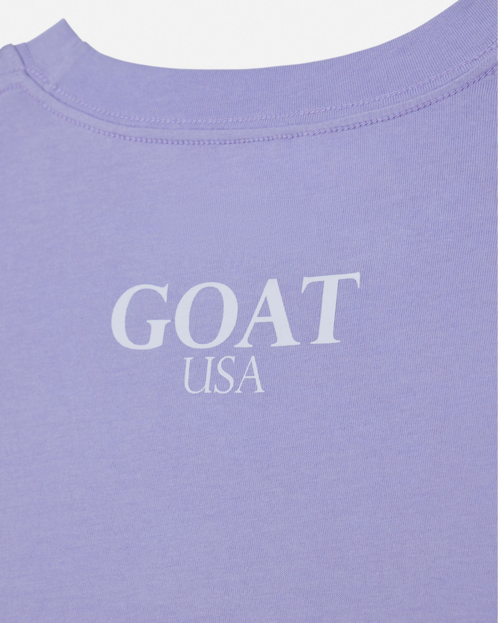 Purple shirt with 'GOAT USA' text on a plain background#color_periwinkle