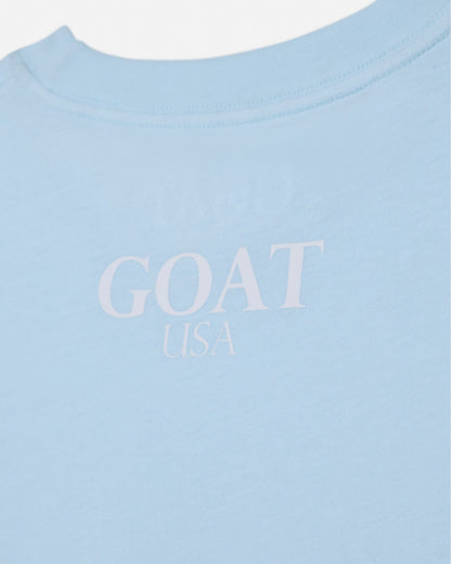 Light blue shirt with 'GOAT USA' text on a white background#color_delicate-blue