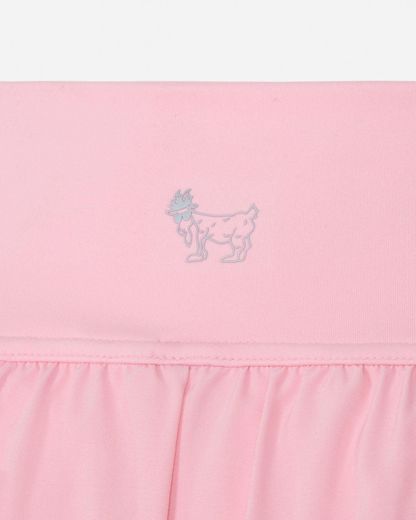 Close-up of a pink short with a small design on a white background#color_pink
