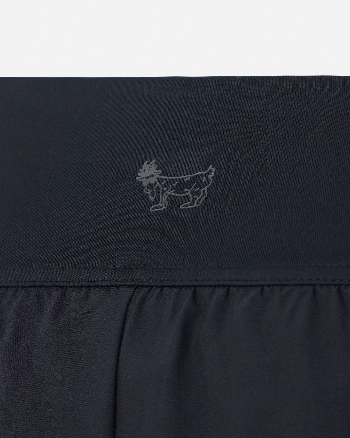 Black fabric with a small logo on a white background#color_black