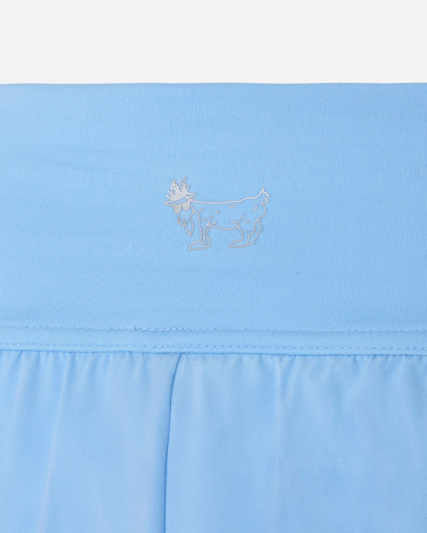 Light blue short with a subtle logo on a white background#color_carolina-blue