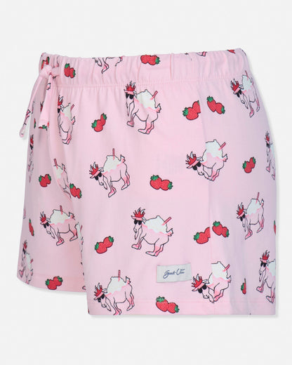 Pink shorts with goat and strawberry pattern on a white background