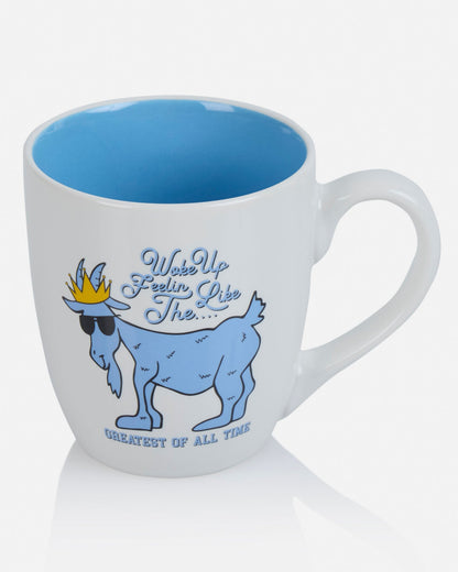 Mug with blue interior, goat graphic, and text on a white background