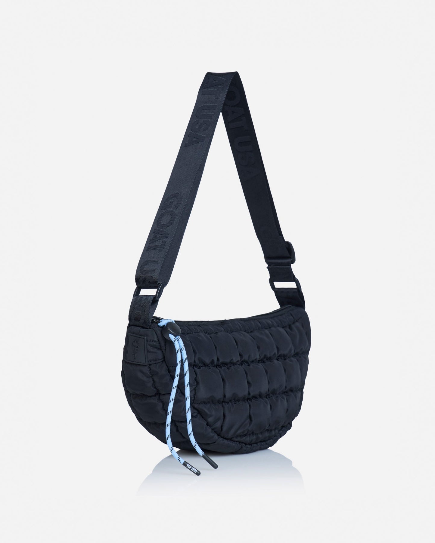 Angled view of black sling bag