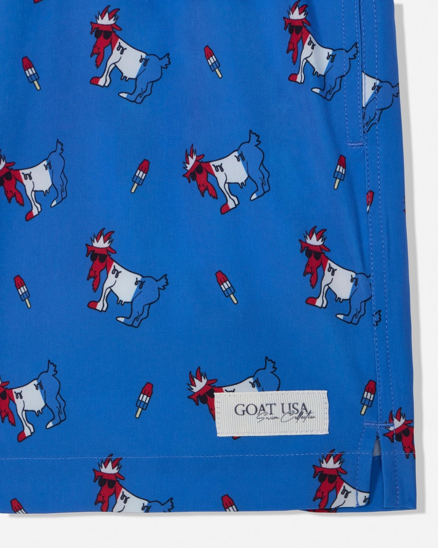 Blue fabric with cartoon goat pattern and 'GOAT USA' label