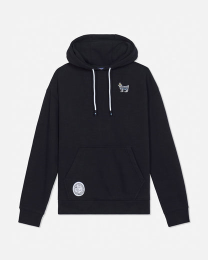 A black pullover hoodie with white drawstrings, featuring a small white graphic on the left chest and a circular white patch on the lower left front, displayed against a light gray background.