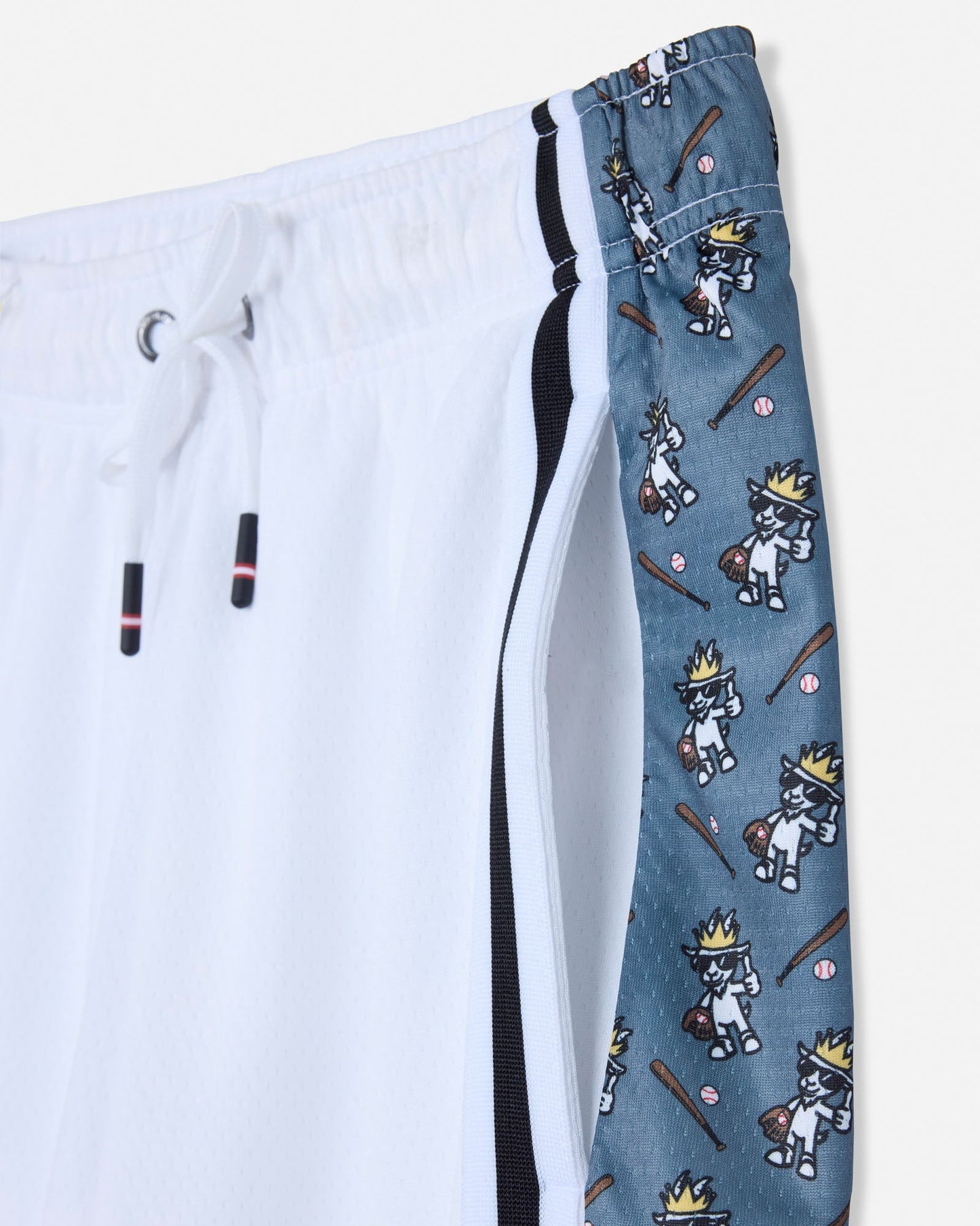 Close-up of pocket on white mesh shorts