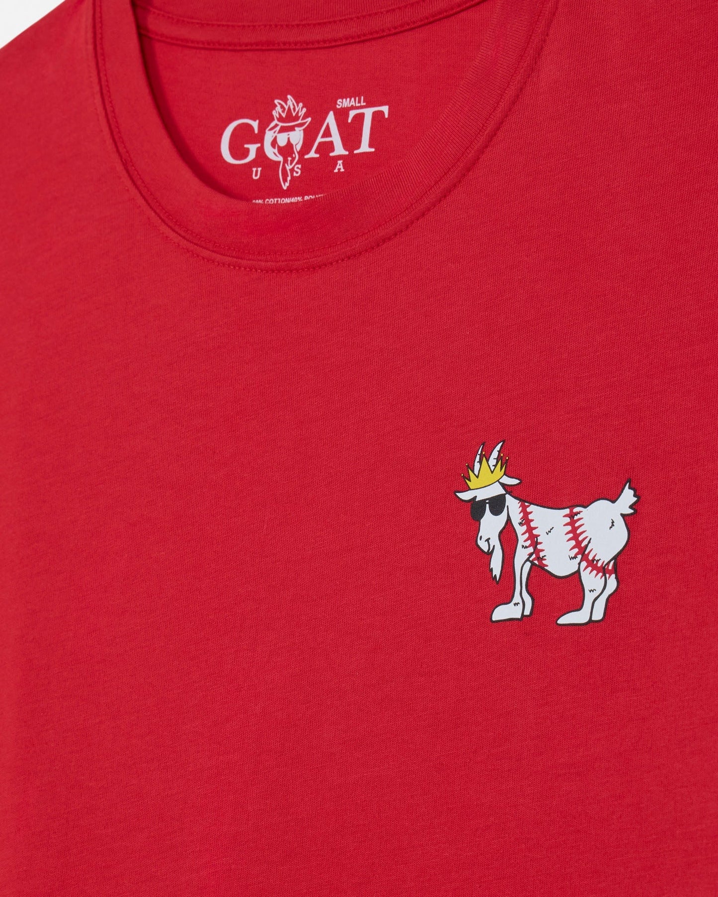 Red t-shirt with a small goat graphic and 'Small GOAT USA' text on a red background