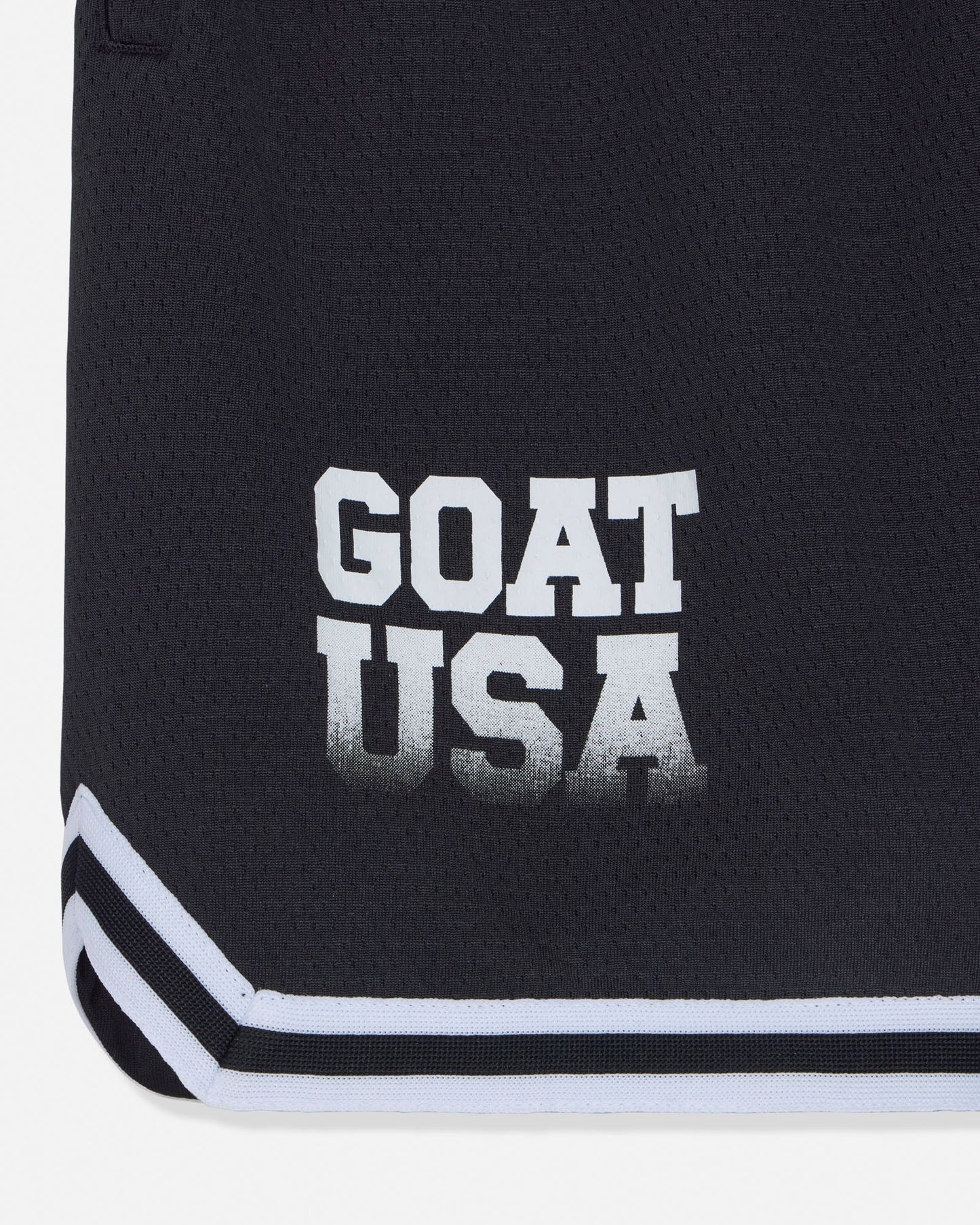 Close-up of 'GOAT USA' text n black shorts#color_black