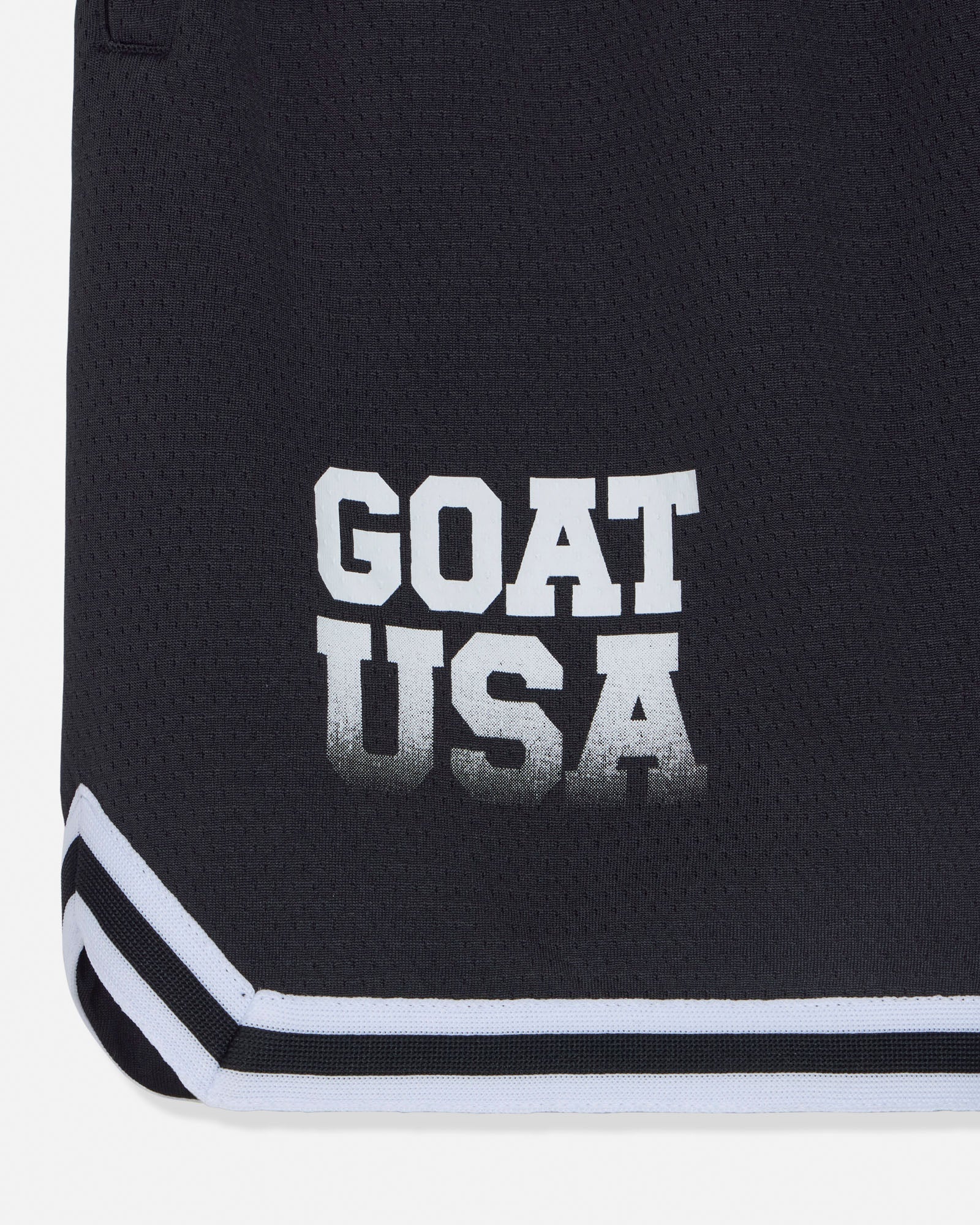 Close-up of 'GOAT USA' text n black shorts#color_black