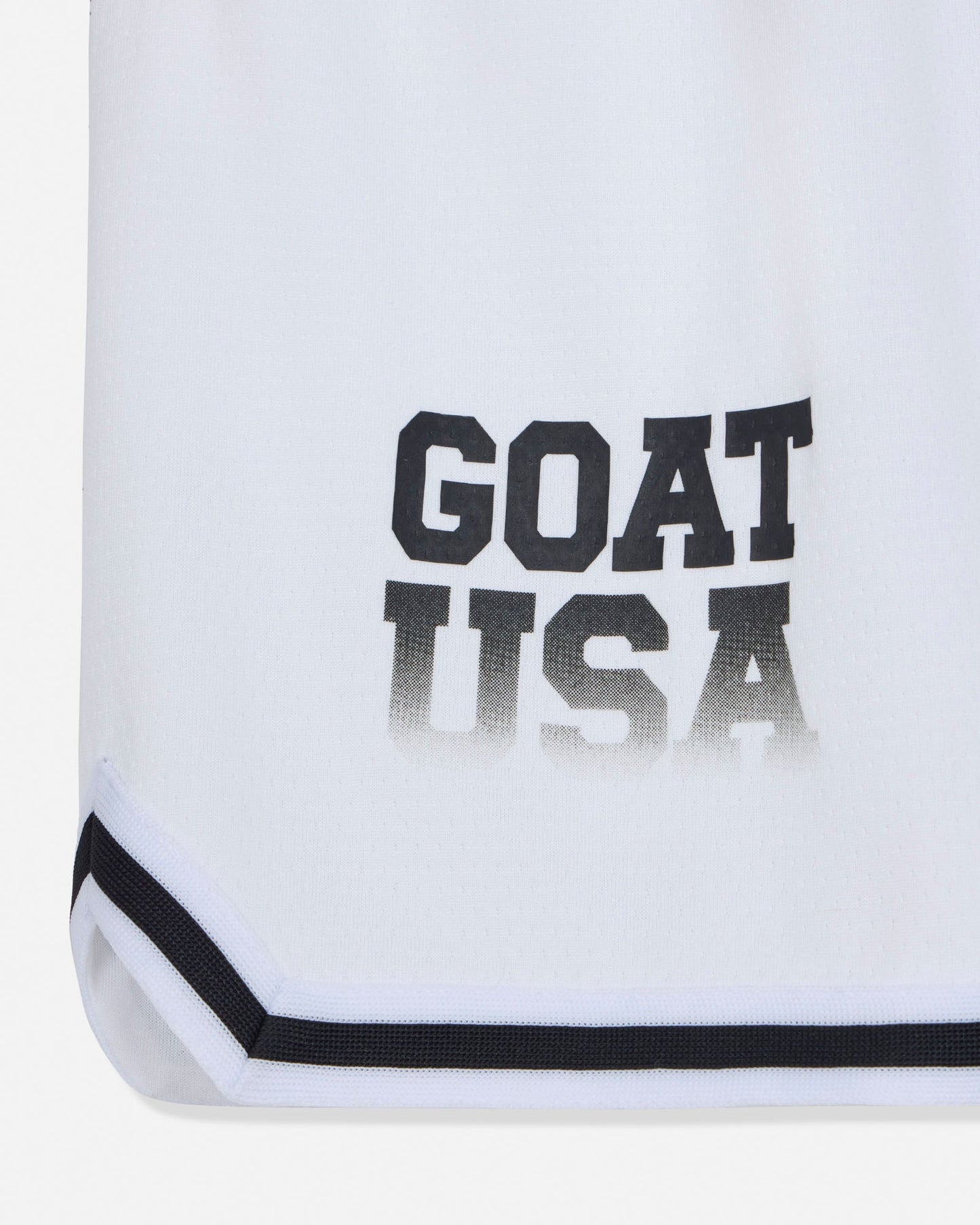 White shorts with 'GOAT USA' text on a white background#color_white