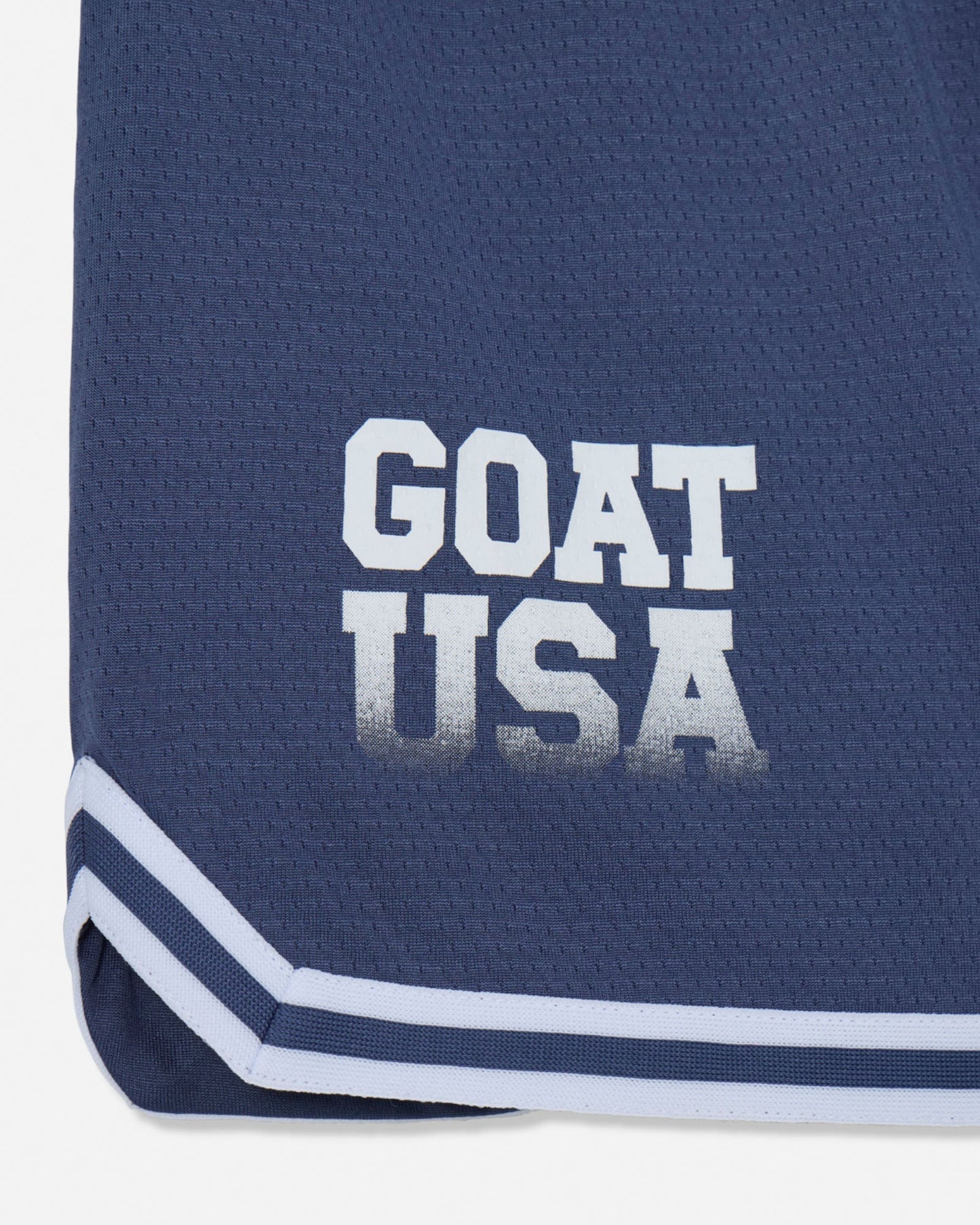 Close-up of "GOAT USA" text on navy mesh#color_navy