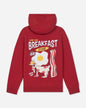 A red pullover hoodie shown from the back, featuring a large graphic print of a breakfast-themed goat wearing sunglasses, with text reading 'GOAT USA BREAKFAST CLUB' and 'BACON EGGS'.