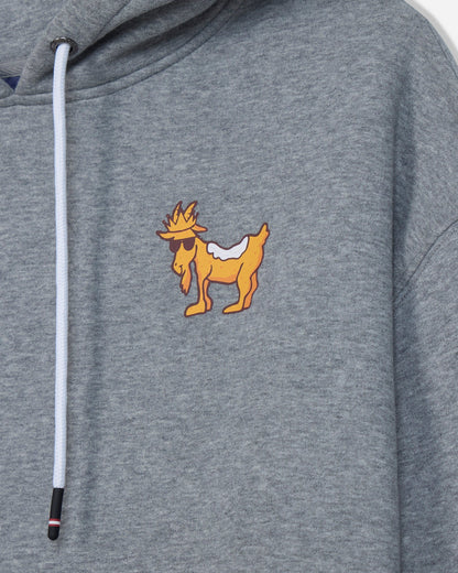 Close-up of a heather gray hoodie featuring a cartoon goat graphic on the left chest with a white drawstring.