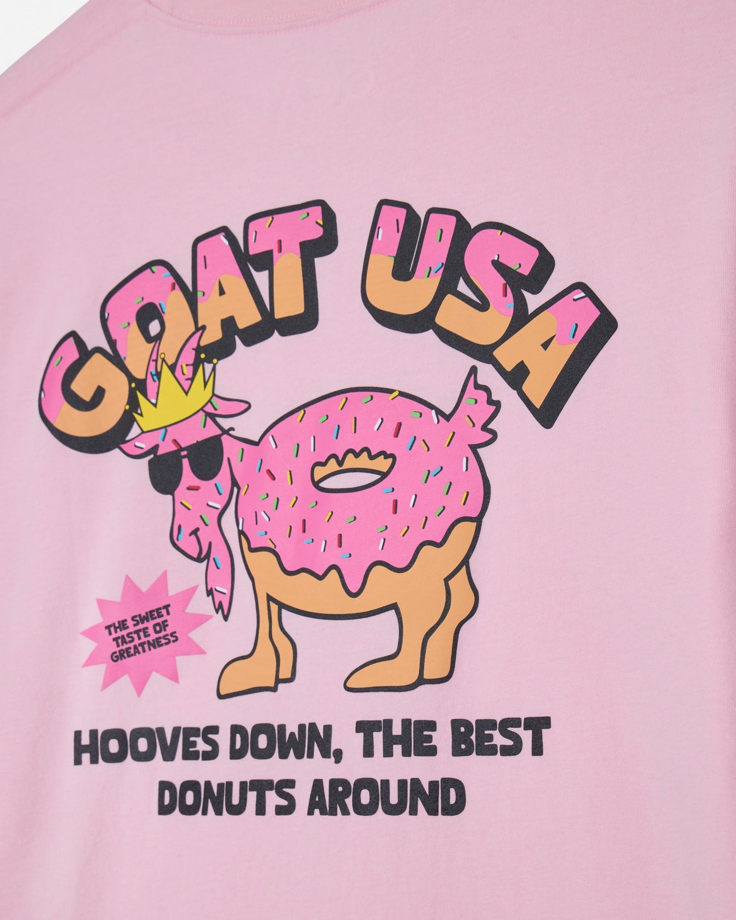 Pink t-shirt with a cartoon donut and text on a pink background