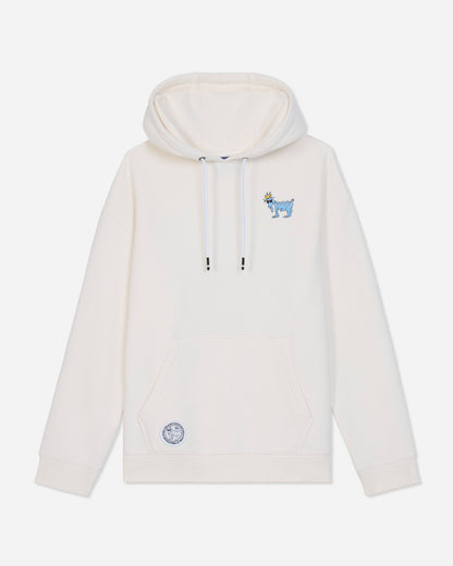 An off-white pullover hoodie with a small blue embroidered goat graphic on the left chest and a matching circular patch on the lower left front, displayed against a light gray background.