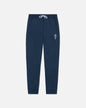 Navy blue sweatpants with a small embroidered design on a white background