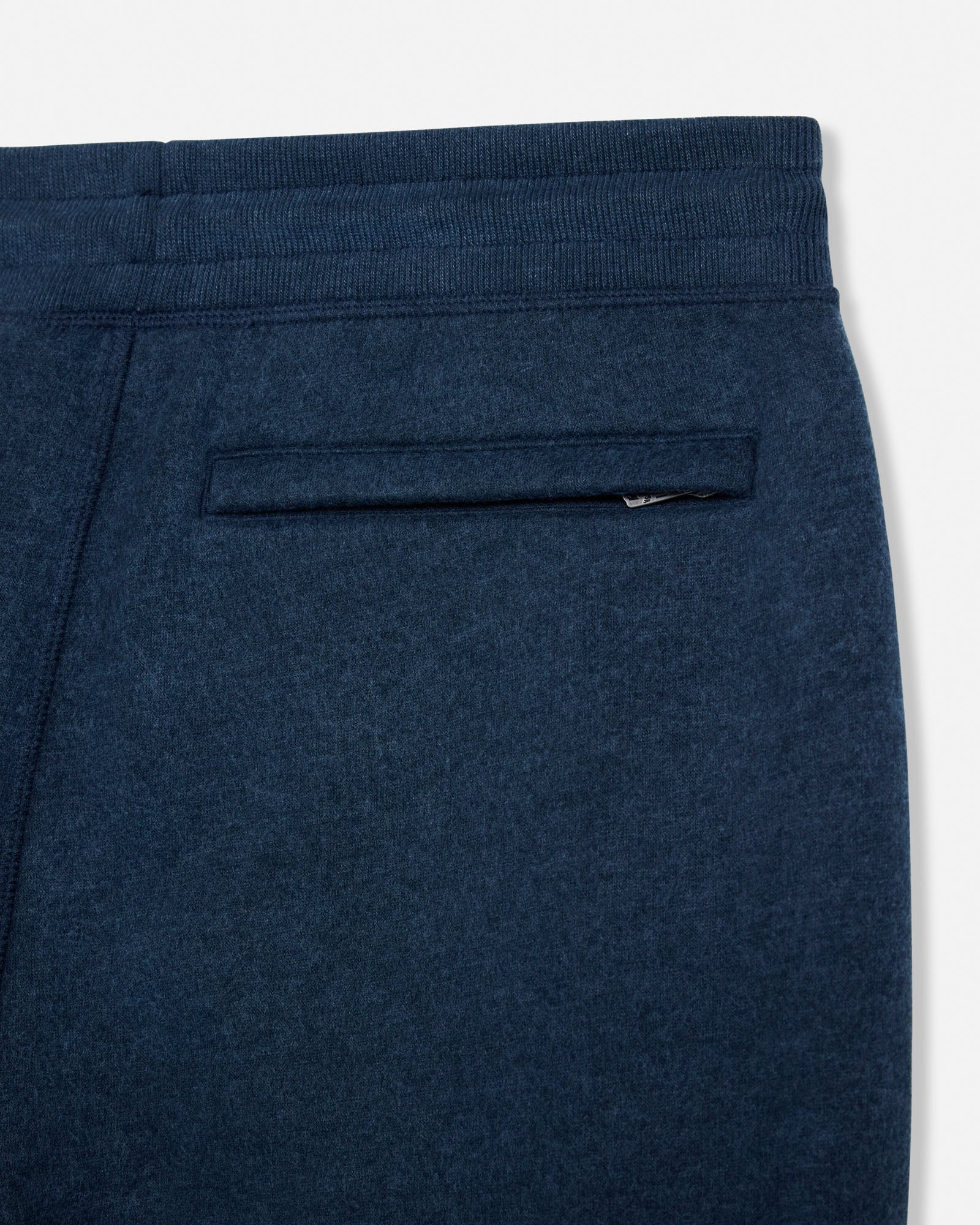 Navy blue sweatpants with a pocket on a white background