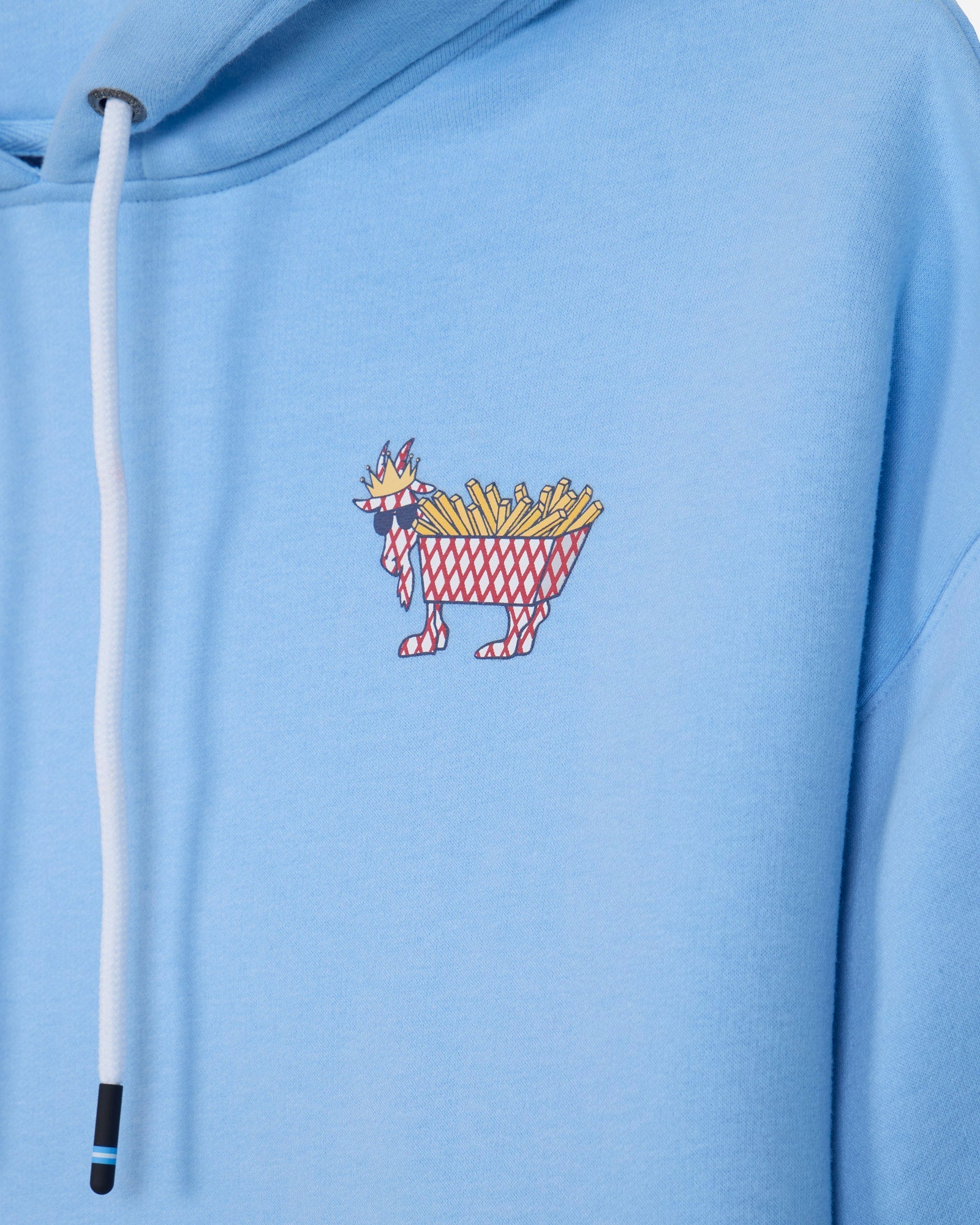 Close-up of a light blue hoodie with a white drawstring and a small embroidered graphic of a crowned figure carrying a basket of fries on the chest.