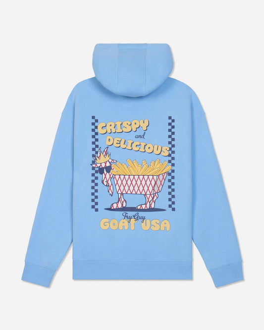 A light blue hoodie shown from the back, featuring a graphic print of a goat wearing sunglasses and a crown, holding a basket of french fries. The text reads 'CRISPY and DELICIOUS' and 'Fry Guy GOAT USA'.