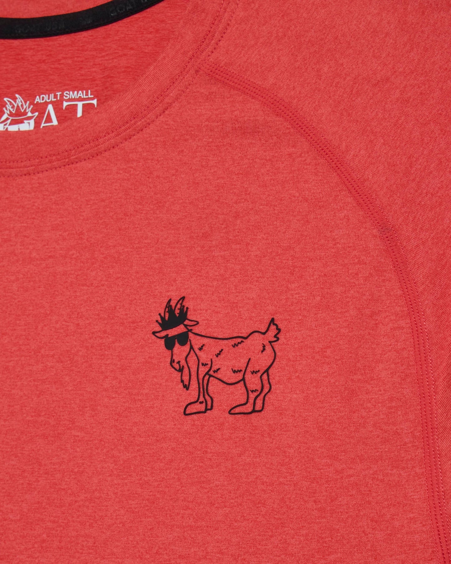 Red shirt with a black goat logo and 'GOAT' branding.#color_poinsettia