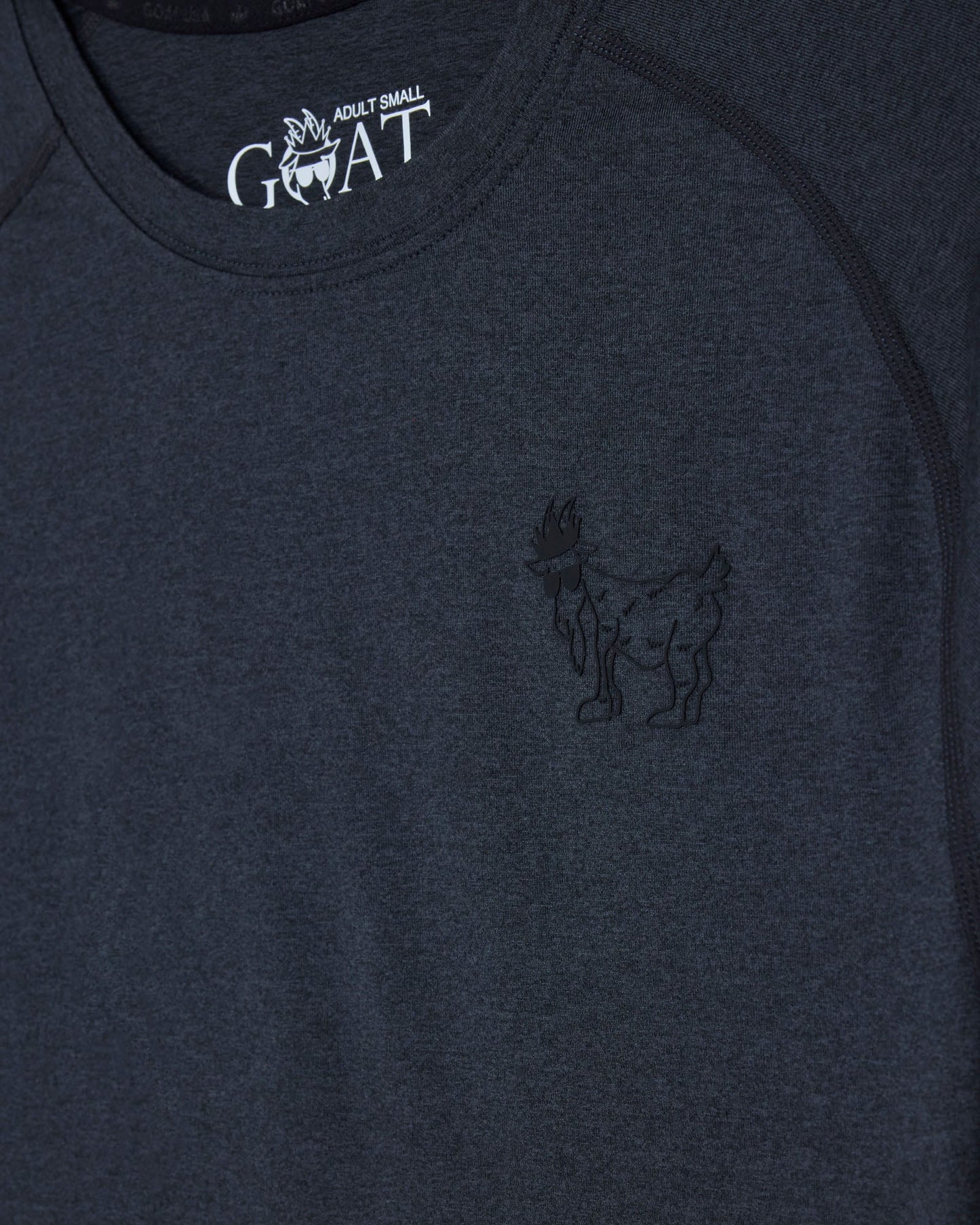 Black t-shirt with a logo on the chest and 'GOAT' branding above it#color_black