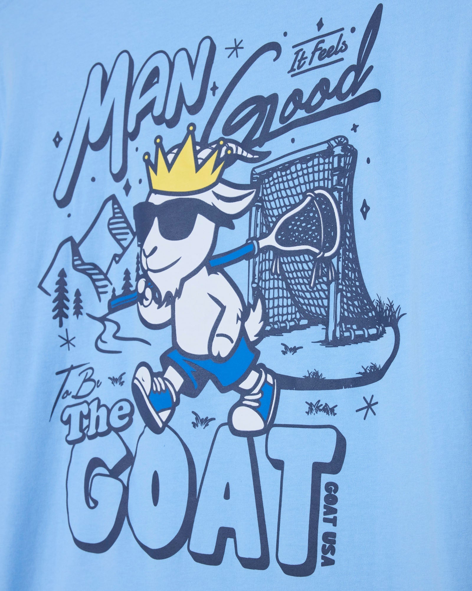 T-shirt design with a cartoon goat wearing a crown, holding a lacrosse stick, and text on a light blue background.