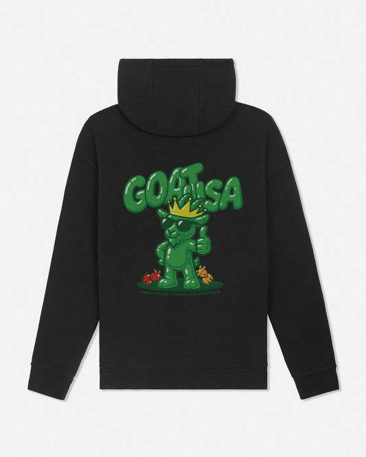 A black pullover hoodie shown from the back, featuring a large green graphic of a cartoon character wearing a gold crown and the word 'GOAT USA' in bold green letters above it.