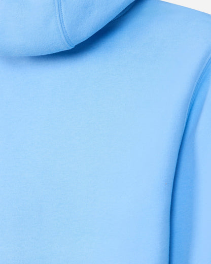 A close-up of a light blue hooded sweatshirt showing the smooth fabric texture, hood seam, and shoulder area.