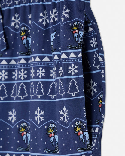 Navy blue fabric with white snowflake, tree, and skier pattern