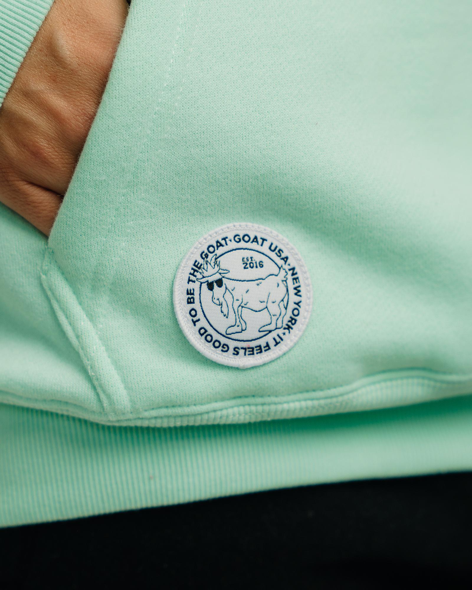 Close-up of patch on mint WG Hooded Sweatshirt#color_mint
