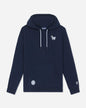 A navy blue pullover hoodie with white drawstrings, featuring a small white embroidered goat logo on the left chest and a circular white patch on the front pocket, displayed against a light gray background.#color_navy-blazer