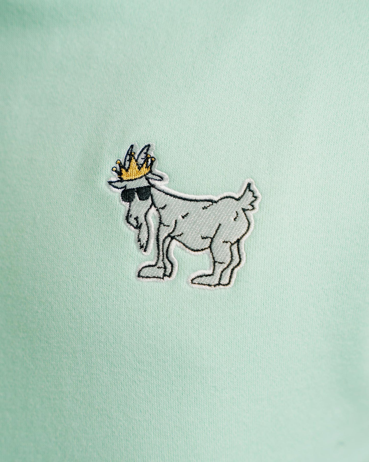 Close-up of logo on mint WG Hooded Sweatshirt#color_mint