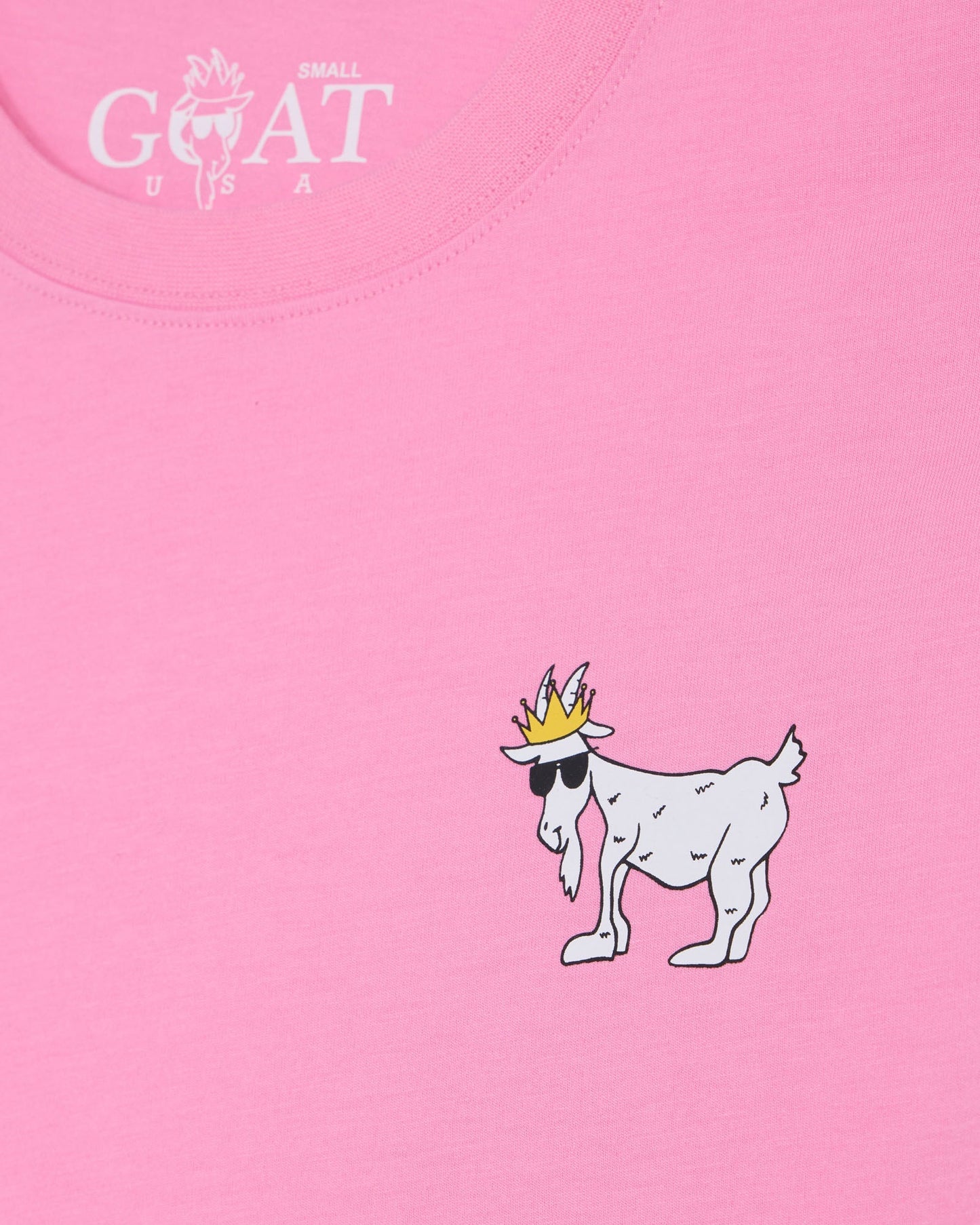 Pink t-shirt with a cartoon goat wearing a crown and sunglasses, and 'GOAT USA' logo.#color_paradise-pink