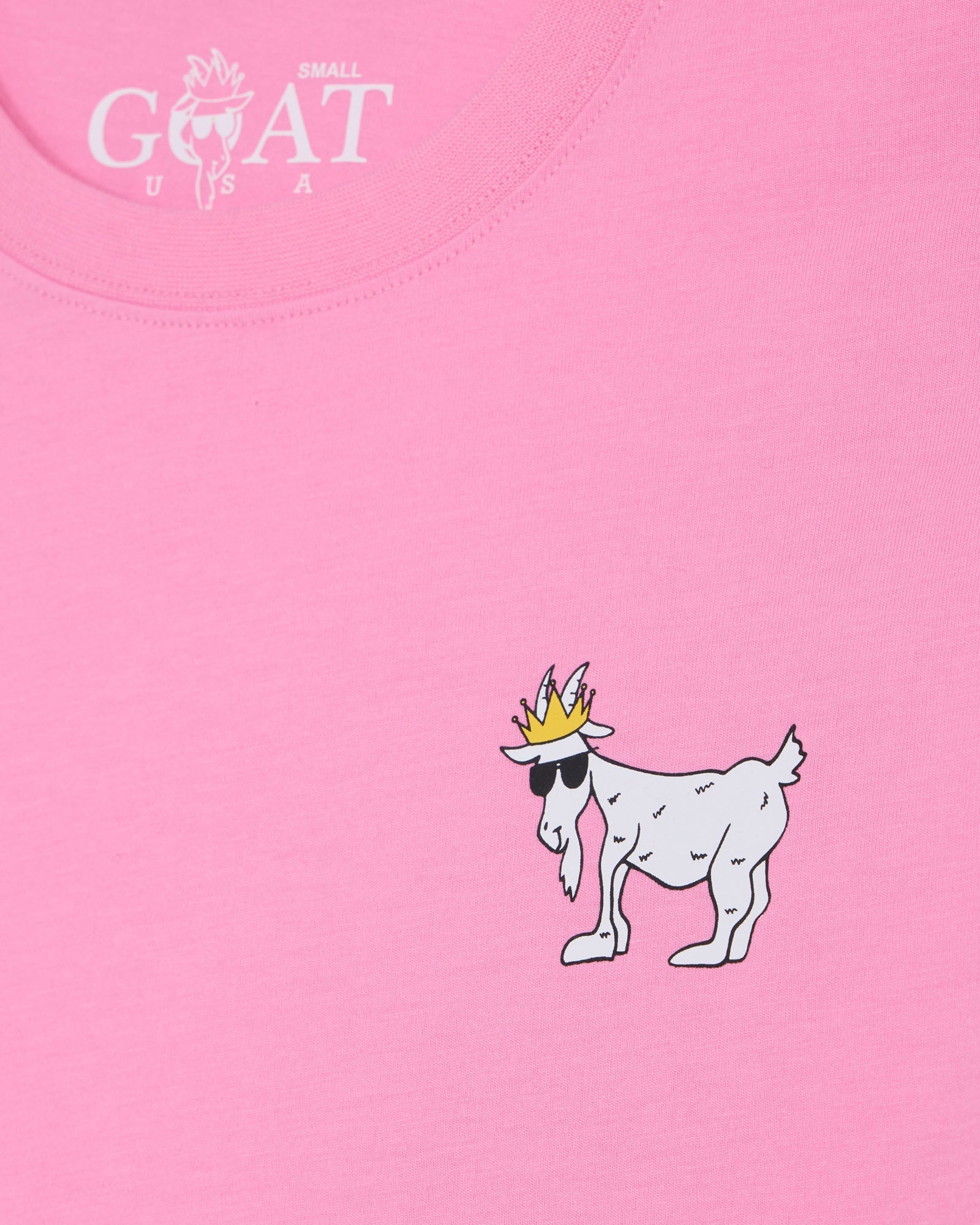 Pink t-shirt with a cartoon goat wearing a crown and sunglasses, and 'GOAT USA' logo.#color_paradise-pink